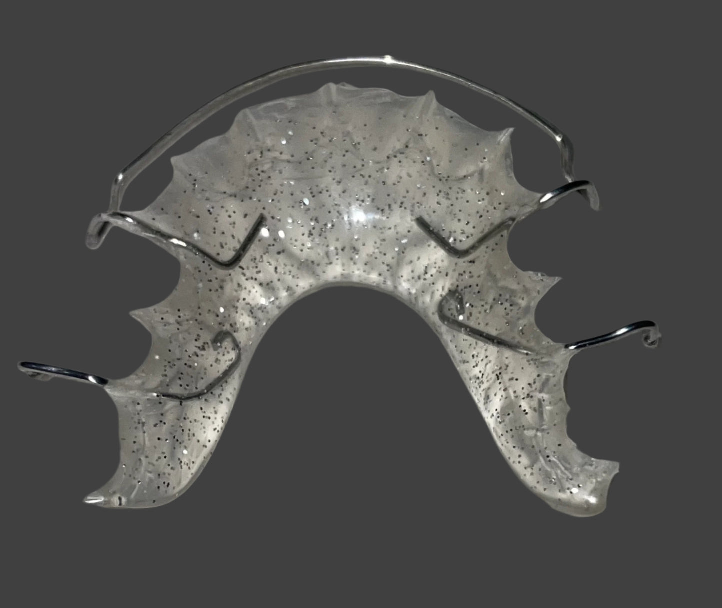 "Close-up of stainless steel wire on Hawley retainer"