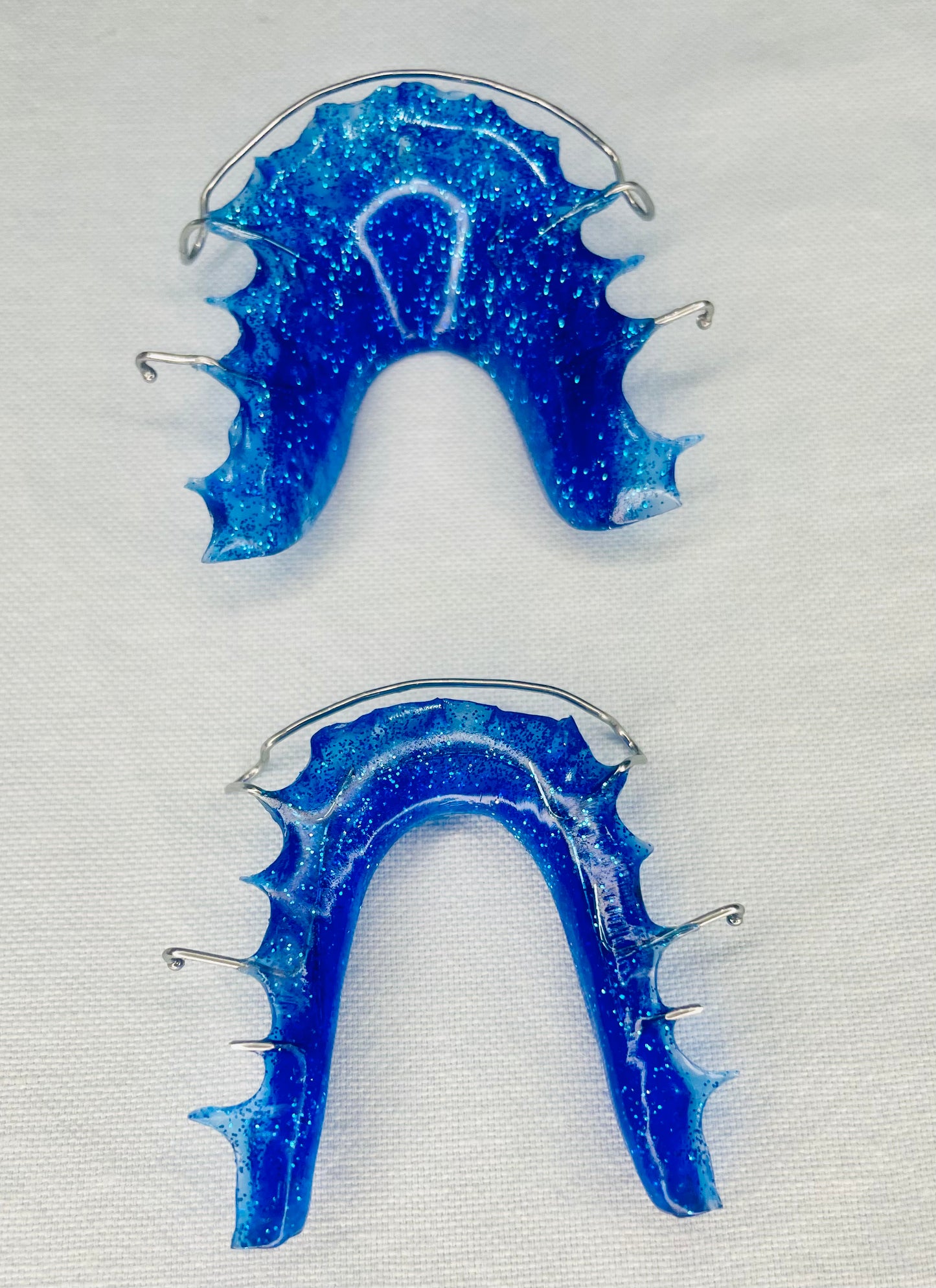 "Blue acrylic Hawley retainer with stainless steel wire"