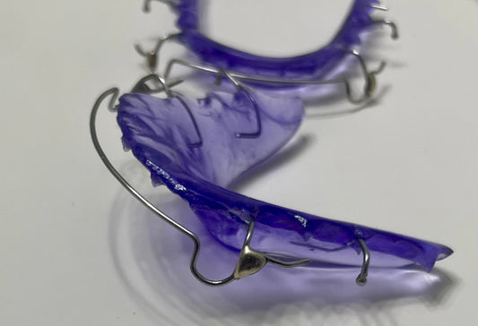 “Custom Hawley retainer with soldered C clasps”