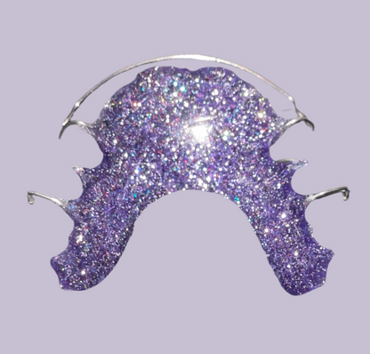 "Purple Glitter Hawley retainer with lab-quality finish"